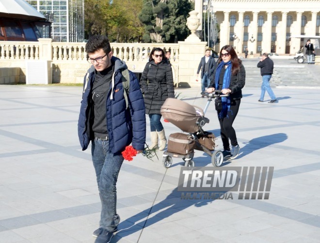 Baku residents bringing flowers to Seaside Boulevard to honor missing oil workers.  Azerbaijan, Dec.07, 2015